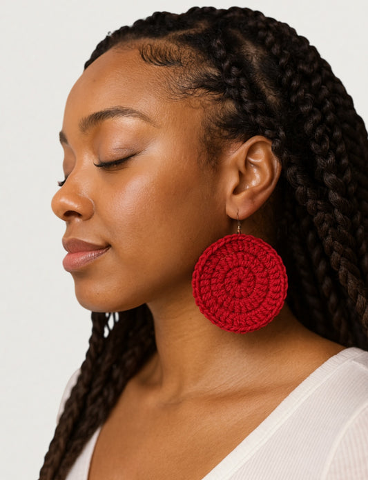 Black woman in red crochet earrings by Knotted Joy by Victoria 